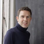 Headshot of David Robson, author of The Intelligence Trap